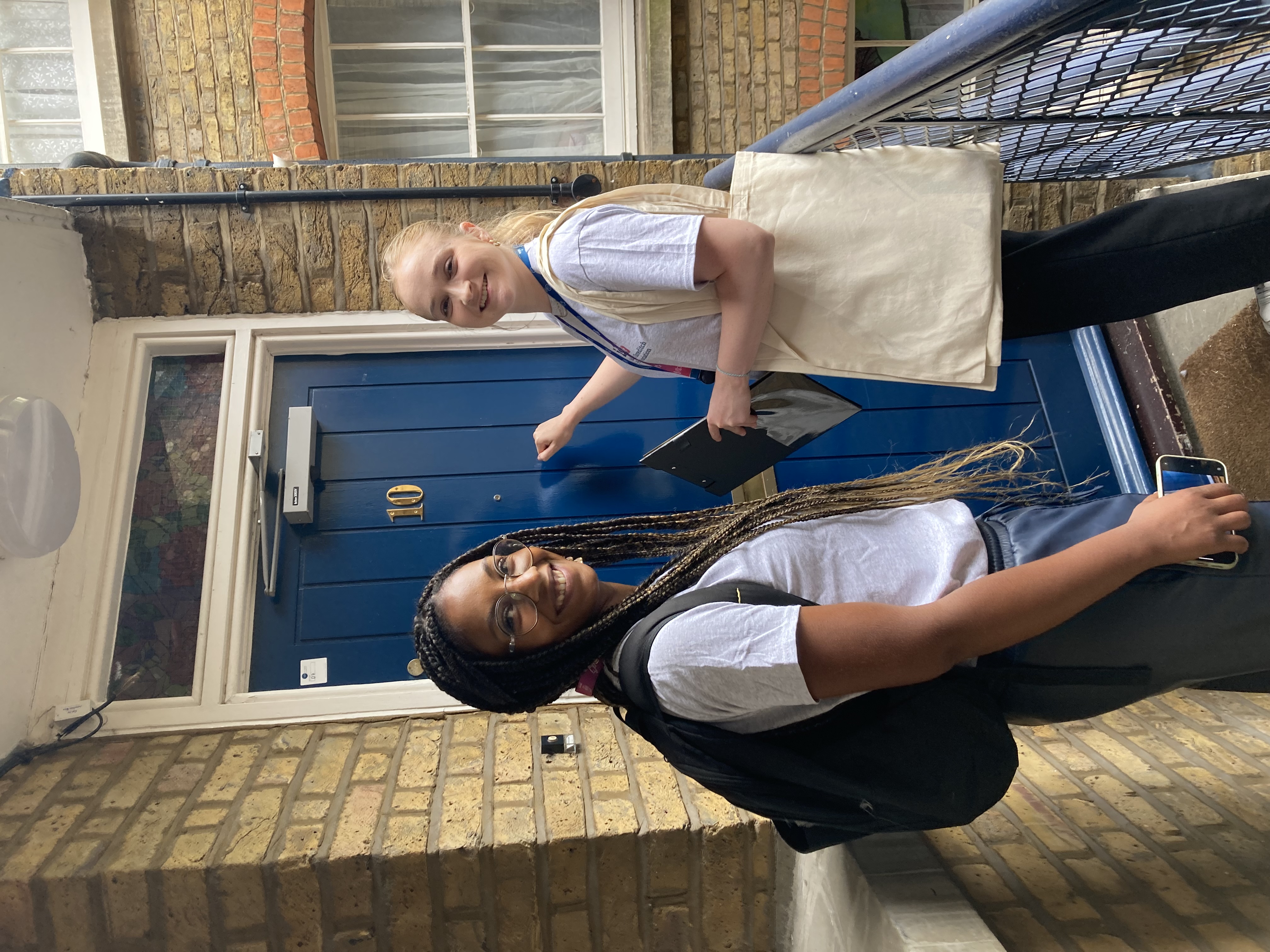 ISHA staff knocking on a residents door to catch up with them.