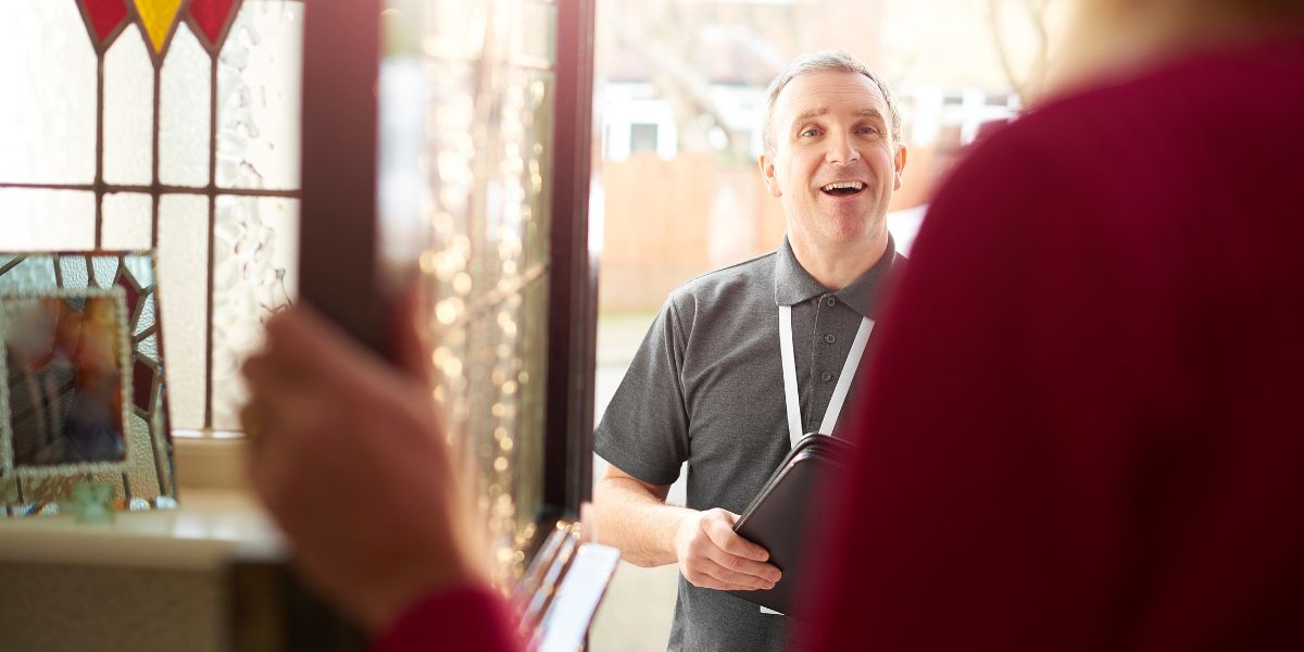 A man with an ID at the door of a resident