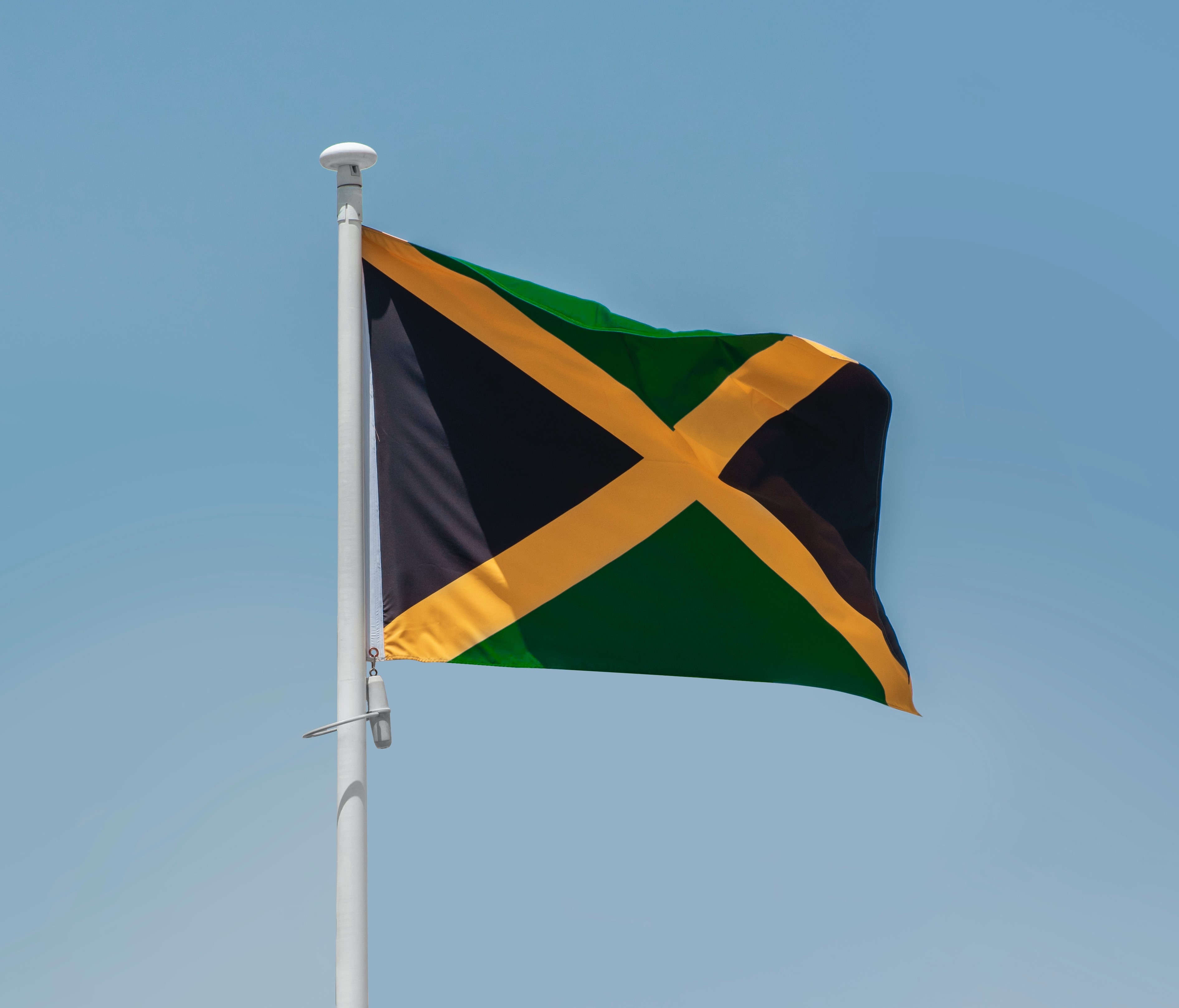 Image of Jamaican flag being flown