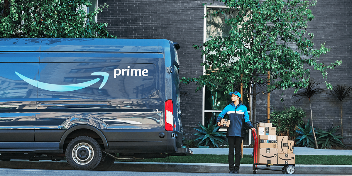 An Amazon delivery van and driver