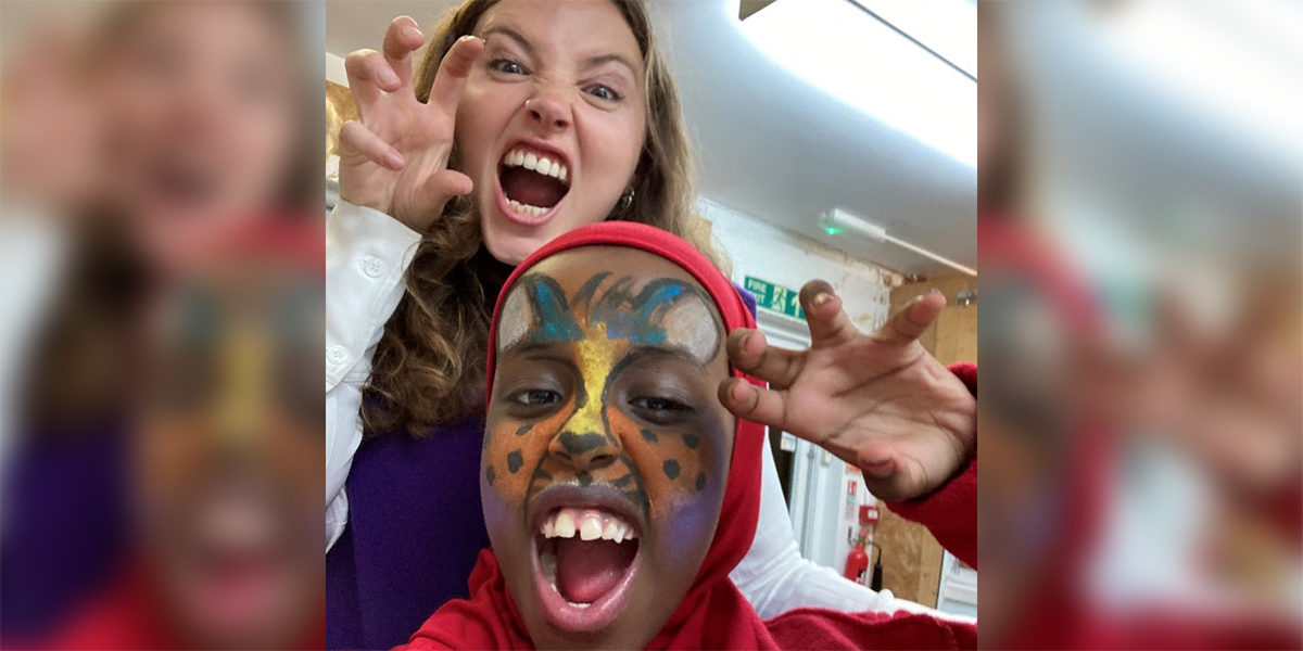 Beth and a young resident enjoying the face painting activity at the Waltham Forest residents' meeting