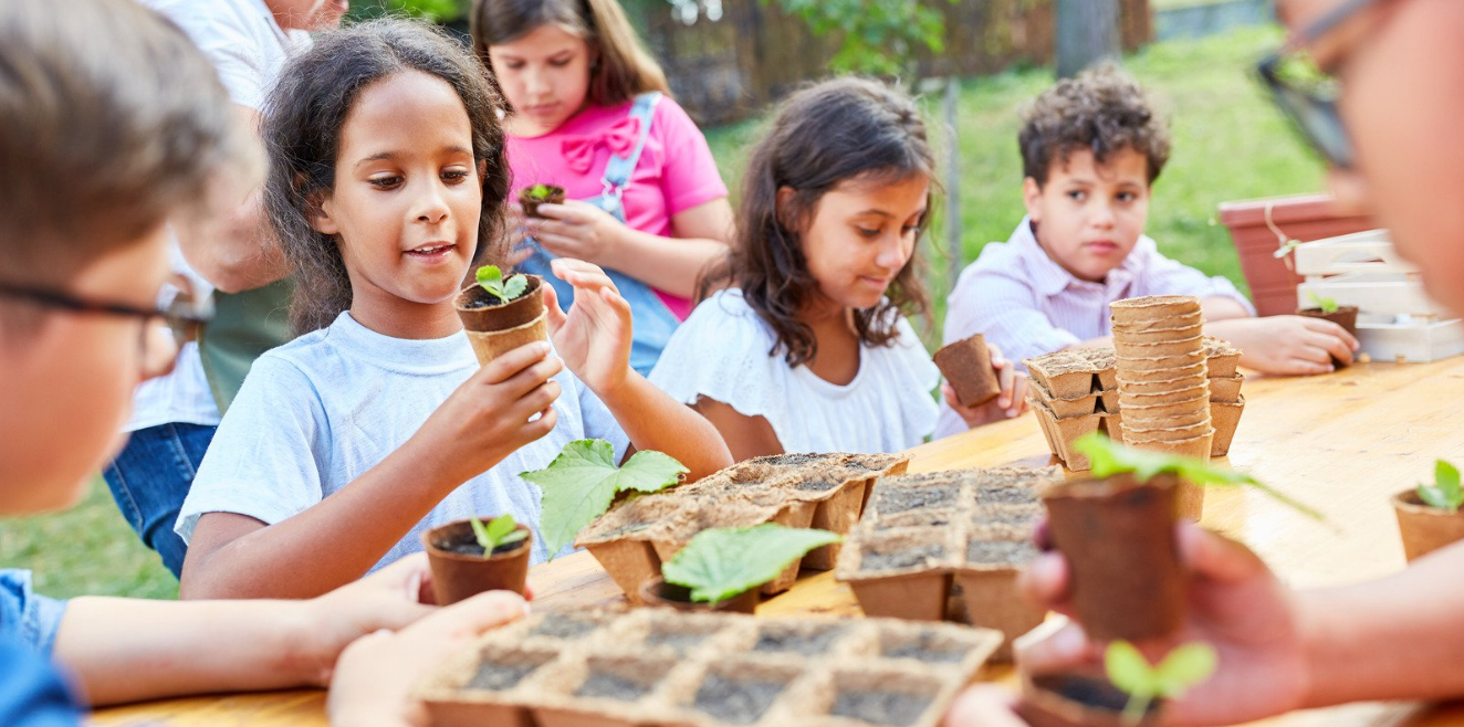Kids potting plants