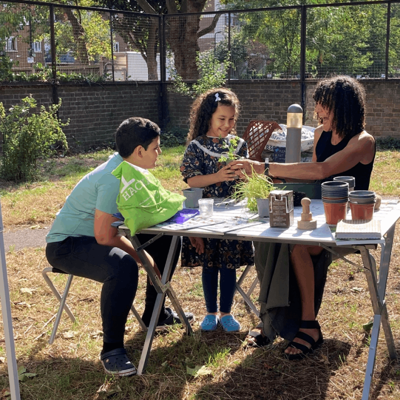 Two young residents learning about gardening
