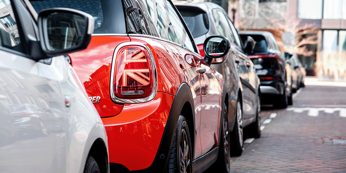 Cars parked along the side of a road