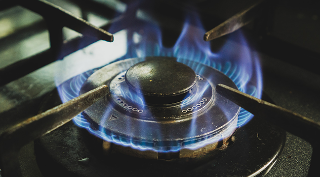 A gas burner on a kitchen hob