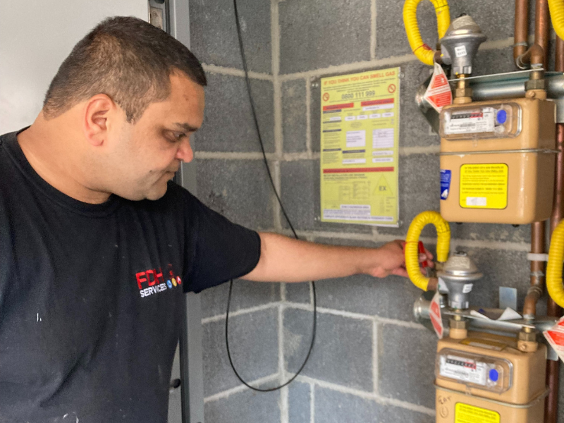 A contractor carries out a gas inspection. 