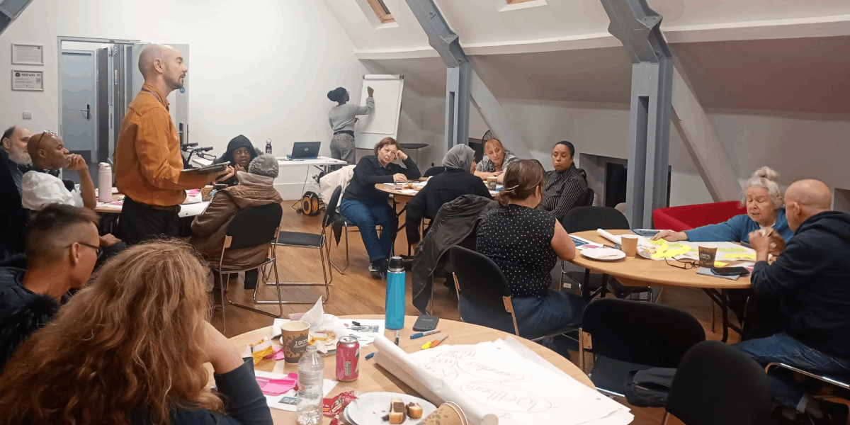ISHA residents, staff and representatives from HACT and EcoACTIVE at a community mapping event in October 2026.