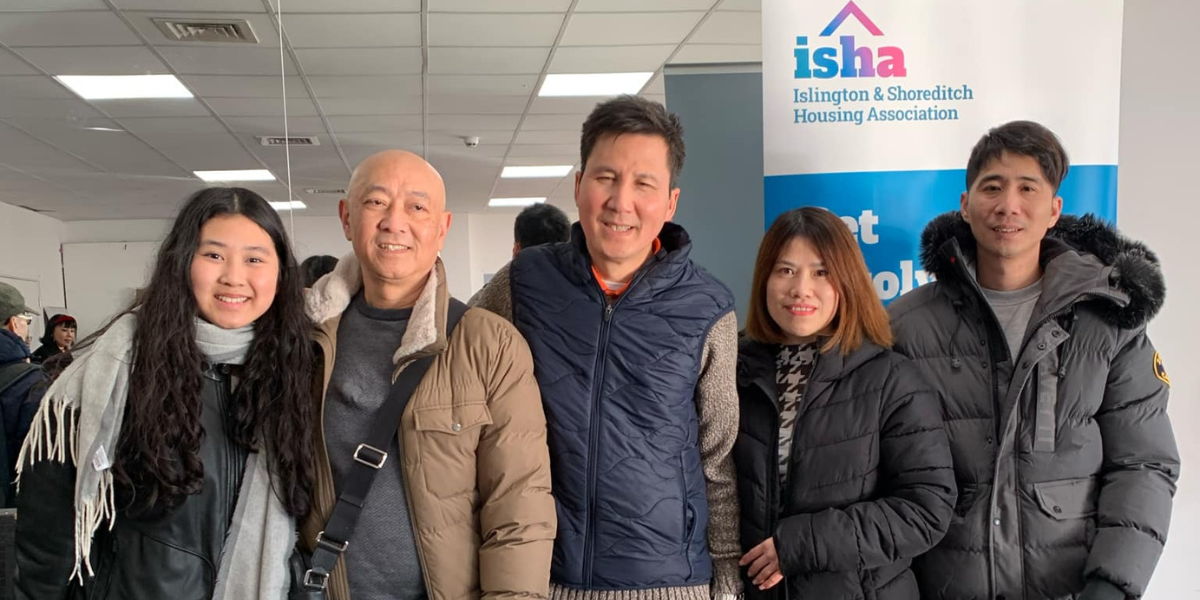 Chuong (an Outreach and Support Officer) with ISHA residents at a 2025 Lunar New Year (Tết) celebration.