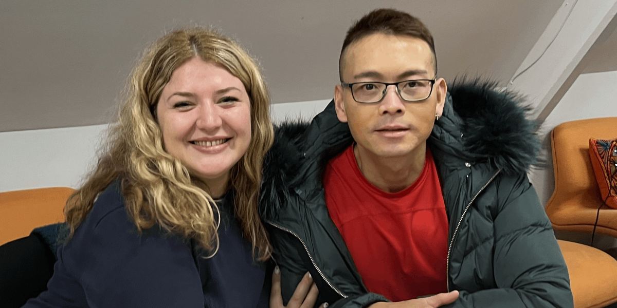 ISHA residents Zana and Anh-Tuan at a resident event in October 2026.