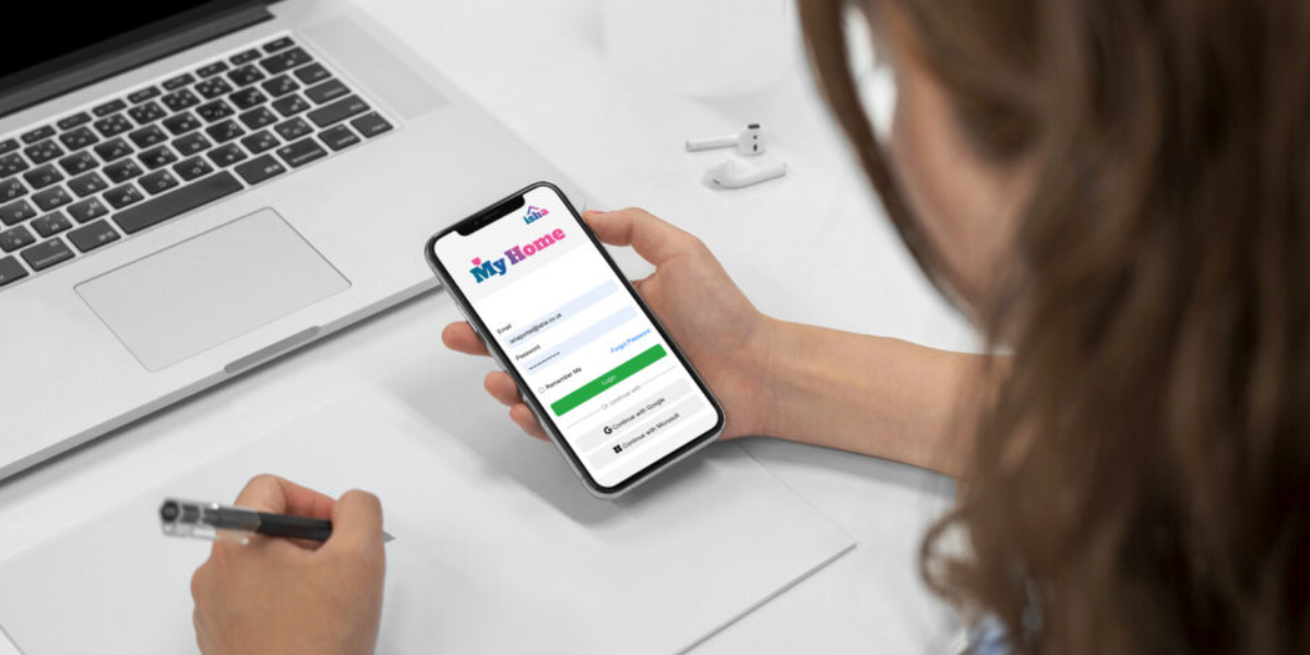 A woman accesses the portal on her smartphone. 